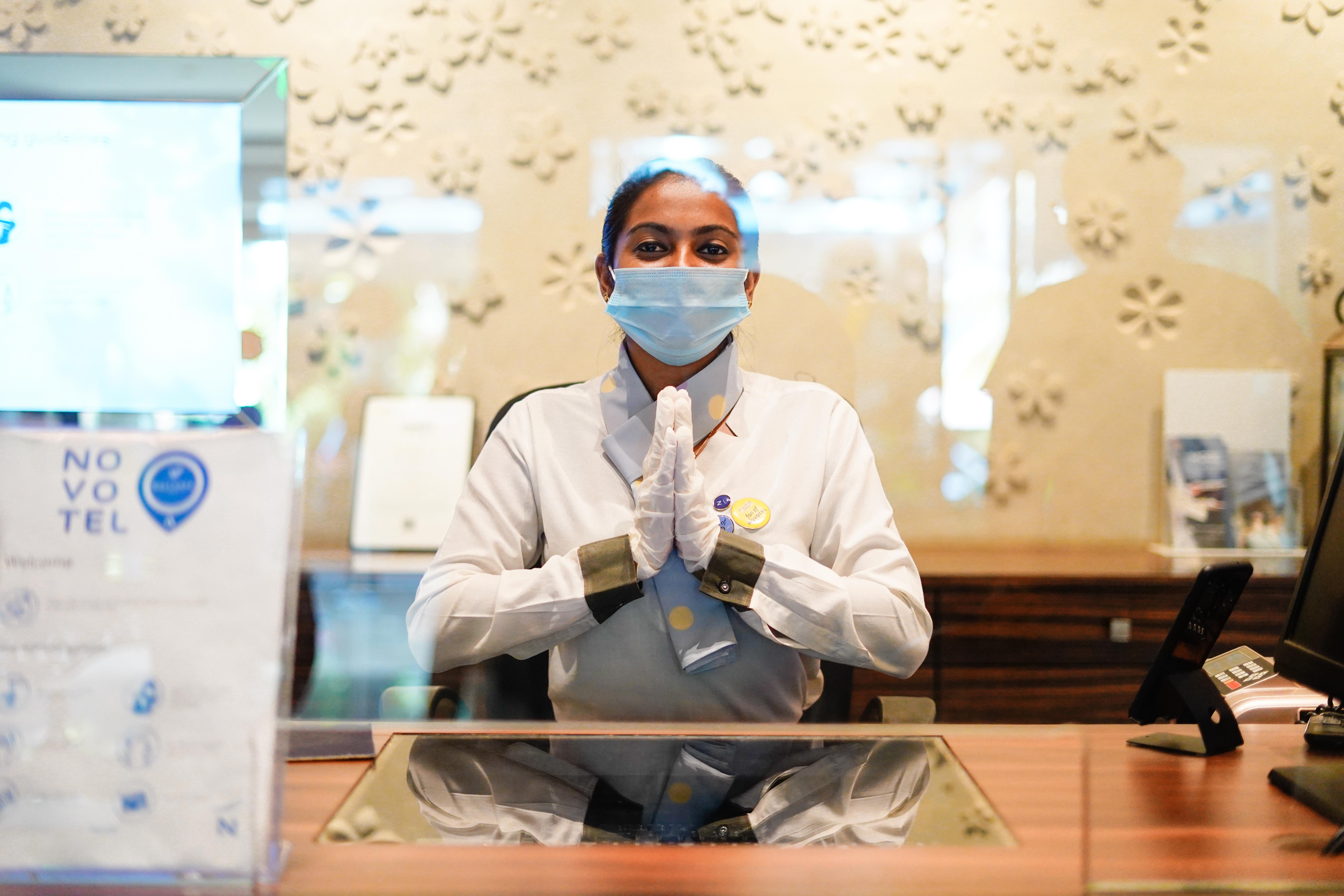 Novotel Goa Resort & Spa Кандолим Екстериор снимка A hotel employee wearing a face mask