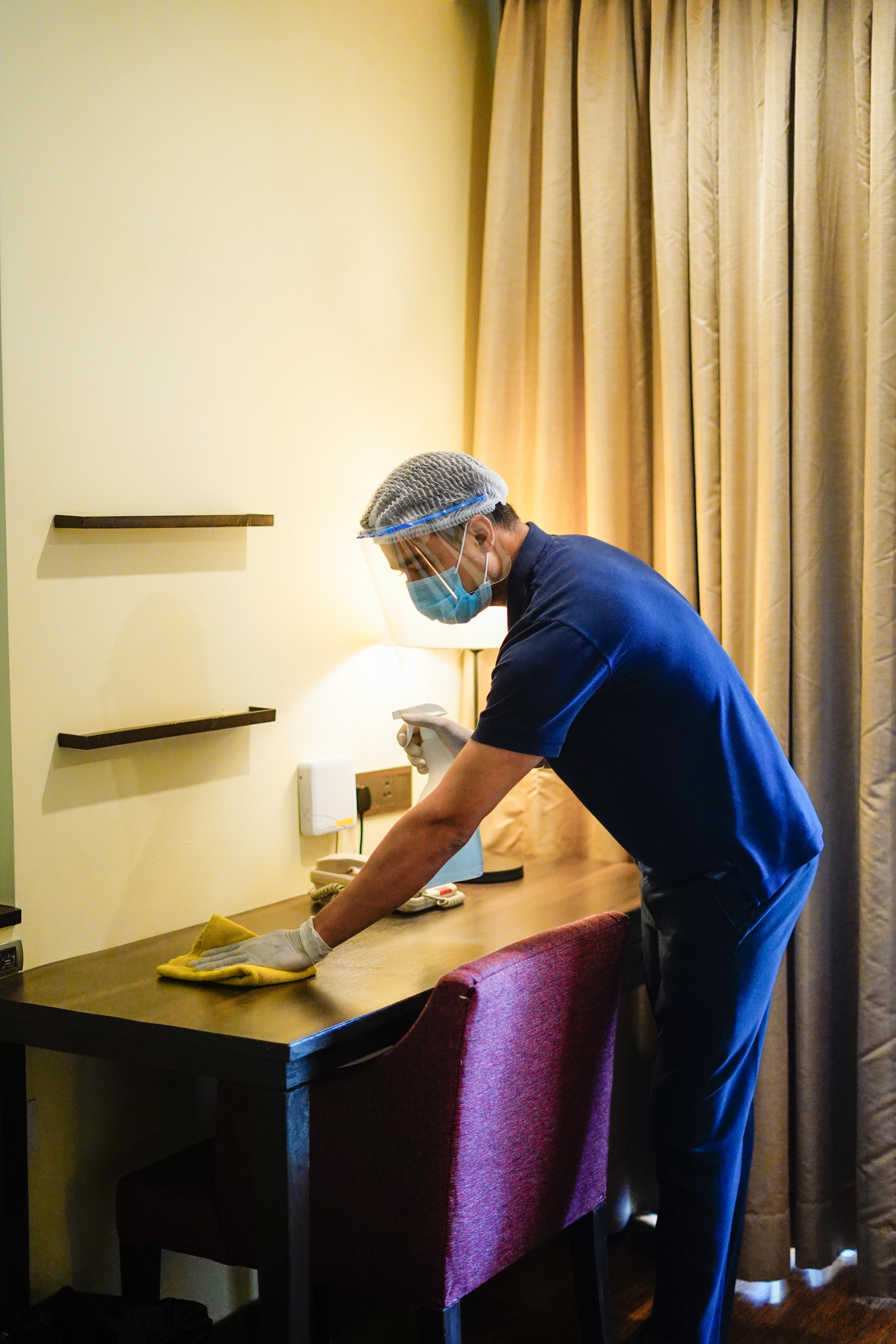 Novotel Goa Resort & Spa Кандолим Екстериор снимка A hotel housekeeper wearing a face shield and gloves